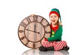 Christmas concept. Little Elf with clock isolated on white Royalty Free Stock Photo