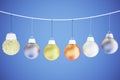 Christmas concept with multicolored balls on the rope - christmas tree toys at blue background Royalty Free Stock Photo