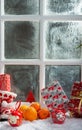 Christmas concept with oranges with snow, wooden window background Royalty Free Stock Photo