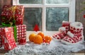 Christmas concept with oranges with snow, wooden window background Royalty Free Stock Photo