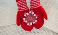 Christmas concept Red mittens with toy snowflake on a white background Royalty Free Stock Photo