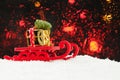 Christmas concept. Santa sleigh driving gold gift and Xmas tree against abstract bokeh light background Royalty Free Stock Photo