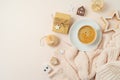 Christmas concept with Scandinavian style, cozy eco friendly ornaments and coffee cup on bright background. Top view, flat lay Royalty Free Stock Photo