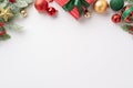 Christmas concept. Top view photo of red green and gold baubles star ornament giftbox with ribbon bow mistletoe berries and pine Royalty Free Stock Photo