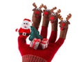 Christmas concept toy Santa Claus and reindeer with gifts on hand Royalty Free Stock Photo