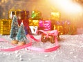 Christmas concept, toy santa sleigh, gift boxes on snow and blur bokeh, Empty wooden sled Royalty Free Stock Photo