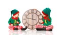 Christmas concept. Two little elf helper of Santa with clock iso Royalty Free Stock Photo