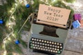 Christmas concept - typewriter with text "Happy New Year 2019", spruce branches, garland, gift boxes