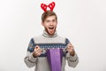 Christmas Concept - Young handsome beard man happy with shopping bag in the hand isolated on white. Royalty Free Stock Photo