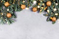 Christmas concrete background with fir tree and golden toys and lights. Royalty Free Stock Photo
