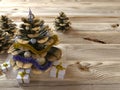 Christmas cone with gifts on wood texture