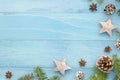Christmas coner frame. Rustic blue wooden panks with christmas tree,anice star, pine cones and fir tree. Winter holiday