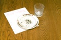Christmas Cookie Crumbs and Empty Milk Glass on Table