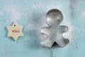 Christmas cookie cutter on vintage aqua blue wood table. Royalty Free Stock Photo