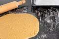 Christmas cookie dough, rolling pin and metal cookie cutters Royalty Free Stock Photo