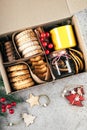 Christmas cookie gift box. Assorted shortbread cookies with holiday decoration. Care package concept