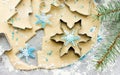 Christmas cookie preparation - raw dough, christmas tree branch Royalty Free Stock Photo