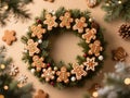 Christmas cookie wreath hung on a decorated tree, featuring assorted gingerbread shapes with icing on pine and fir branches Royalty Free Stock Photo