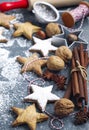 Christmas cookies, cinnamon, nuts and roller pin on dark background Royalty Free Stock Photo