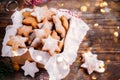 Christmas Cookies in festive box with Christmas Lights on wooden background Royalty Free Stock Photo