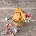 Christmas Cookies in Glass Jar with Candy Cane and Jingle Bells Royalty Free Stock Photo