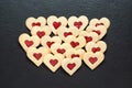 christmas cookies hearts with strawberry jam on slate table Royalty Free Stock Photo