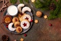 Christmas cookies and milk for Santa: linzer cookies, crescents, almond cookies, chocolate cookies
