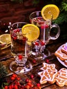 Christmas cookies on plate and two glasses mug with lemon. Royalty Free Stock Photo