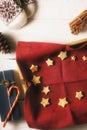 Christmas cookies on the red napkin in the tray with different accessorizes vertical