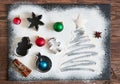 Christmas cooking. Xmas tree made from flour on a dark table, ingredients for baking on dark background, top view