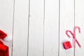 Christmas corner border with gift boxes and red christmas decorations.White wooden board background. Royalty Free Stock Photo