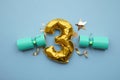 Christmas countdown. Gold number 3 with festive cristmas cracker decorations