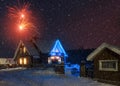 Christmas countryside night background with fireworks during snow