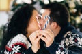 Christmas couple holding candy stick