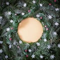 Christmas creative background with circle copy space made of Winter snowflakes,white snow and fresh evergreen tree. Flat lay