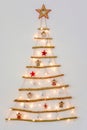 Christmas creative decoration - homemade wooden hanging christmas tree on the wall