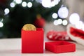 Christmas cryptocurrency,bitcoin in a gift box on background of a christmas tree and lights Royalty Free Stock Photo