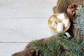 Christmas cup of coffee, scarf and green fir branches on white wood background,copy space