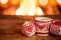 Christmas cup of mulled wine near fireplace Royalty Free Stock Photo