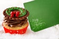 Christmas cupcake with blank card Royalty Free Stock Photo