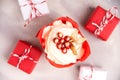 Christmas cupcake with decorations, top view. Christmas card with cupcake with vanilla frosting and red berries