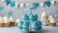 number 2 two A birthday party with blue cupcakes on a cupcake stand. The cupcakes have blue frosting