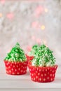 Christmas cupcakes with christmas tree shape, sparkler and lights Royalty Free Stock Photo