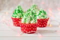 Christmas cupcakes with christmas tree shape, sparkler and lights Royalty Free Stock Photo