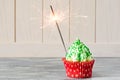 Christmas cupcakes with christmas tree shape, sparkler and lights Royalty Free Stock Photo