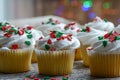 Christmas Cupcakes with Colorful Holiday Lights Royalty Free Stock Photo