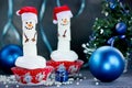 Christmas cupcakes with marshmallow snowman and holiday decoration Royalty Free Stock Photo