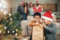 Christmas, curious and children opening gifts, looking at presents and boxes together. Smile, festive and kids ready to Royalty Free Stock Photo