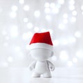 Christmas toy in Red Hat Santa Claus, Symbol New Year, Defocused Lights White Background Royalty Free Stock Photo