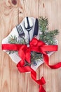 Christmas cutlery and fir tree on wooden background